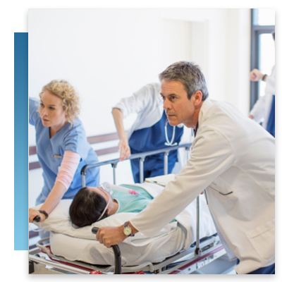 Doctors and nurses rushing a patient through a hospital hallway