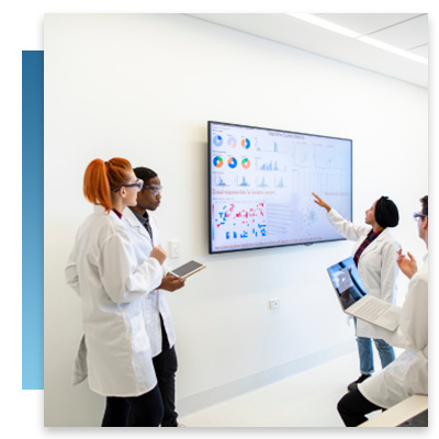 Medical professionals around a digital whiteboard