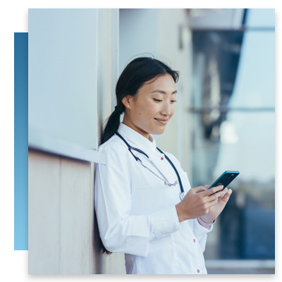 Doctor sending message on phone