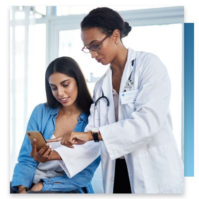 A doctor showing a patient a mobile app