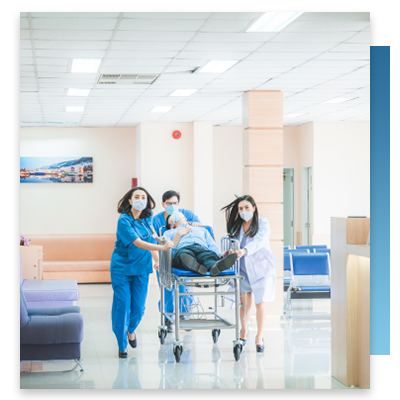 Nurses and doctor rushing a patient through the halls 