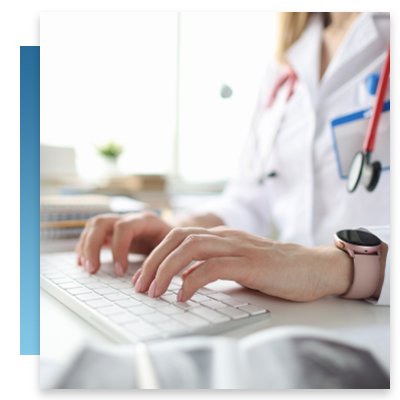 Doctor typing medical info into a computer