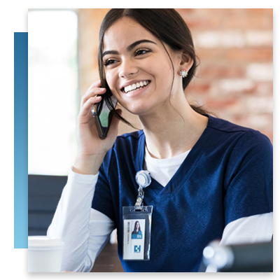 A happy nurse on a mobile device