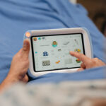 HatchMed-Everett-Facility-09189 2-patient-watching-apple-tv-pillowcase-over-shoulder