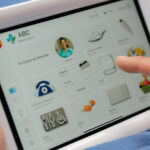 HatchMed-Everett-Facility-09213 2-patient-tapping-pillowcase-tv-remote-app