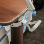 hatchmed-video-stills-6-elderly-patient-smiling-pillowcase-arm-overbed-sunlit-wide
